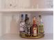 Wet bar with stylish bottles on display, perfect for showcasing your favorite liquors and barware at 3109 Doe Hill Ct, Raleigh, NC 27612