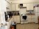 Picture of the kitchen with white appliances, cabinets and floor at 322 Junction Rd # 17D, Durham, NC 27703