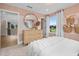 Bright bedroom with a large window, white bedding, dresser and contemporary decor at 353 Belmont Stakes Ln, Wendell, NC 27591