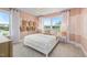 Serene bedroom with a large window, white curtains, and decorative wall baskets at 353 Belmont Stakes Ln, Wendell, NC 27591