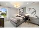 Neutral bedroom features a baseball theme, with modern furniture, stylish lighting, and a bright window at 353 Belmont Stakes Ln, Wendell, NC 27591