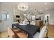 Elegant dining room with a modern chandelier, an open layout, and ample natural light at 353 Belmont Stakes Ln, Wendell, NC 27591