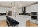 Spacious kitchen with a large island, stainless steel appliances, and modern pendant lighting at 353 Belmont Stakes Ln, Wendell, NC 27591
