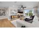 Modern living room with contemporary decor, white sofa, stylish lighting, and wood flooring at 353 Belmont Stakes Ln, Wendell, NC 27591