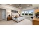 Bright main bedroom with large windows, a tray ceiling, and modern decor at 353 Belmont Stakes Ln, Wendell, NC 27591