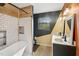 Unique bathroom design with a soaking tub, subway tile shower, and double sink vanity at 3746 Guess Rd, Durham, NC 27705