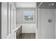 Cozy bathroom with grey vanity, shower, and window providing ample natural light at 3746 Guess Rd, Durham, NC 27705