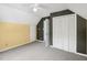 Neutral carpeted bedroom with closet, white trim, and two-tone paint creates a comfortable, modern space at 3746 Guess Rd, Durham, NC 27705