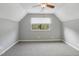 Comfortable bedroom featuring carpeted floors, a ceiling fan, and a bright window at 3746 Guess Rd, Durham, NC 27705