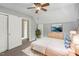 Calming bedroom with soft gray walls, natural light, and a comfortable bed with blue accents at 3746 Guess Rd, Durham, NC 27705