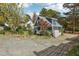 Charming home featuring a cozy front porch, lovely landscaping, and inviting curb appeal at 3746 Guess Rd, Durham, NC 27705