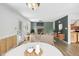 Inviting living room with fireplace, neutral colors, wood floors, and an open floor plan to dining area at 3746 Guess Rd, Durham, NC 27705