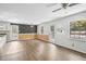 Bright living room, wood floors, open floor plan, and multiple windows for natural light create a warm atmosphere at 3746 Guess Rd, Durham, NC 27705