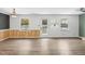 Spacious living room with natural light, wood floors and easy access to the door and windows at 3746 Guess Rd, Durham, NC 27705
