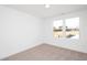 Bedroom with a window offering natural light and neutral carpeting at 3933 Willow Gate Way, Knightdale, NC 27604