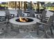Outdoor firepit with seating for residents in a landscaped common area at 3933 Willow Gate Way, Knightdale, NC 27604