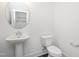 Powder room featuring a pedestal sink and a toilet at 3933 Willow Gate Way, Knightdale, NC 27604