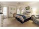 Serene bedroom with a ceiling fan, a cozy sitting area, and natural lighting at 4212 Birmingham Way, Raleigh, NC 27604