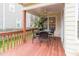 Covered patio has outdoor furniture, a ceiling fan, and a wooden railing at 4212 Birmingham Way, Raleigh, NC 27604