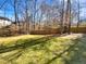 This backyard features a lawn and a wooden fence at 4804 Red Coat Ct, Raleigh, NC 27616