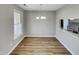 The dining room has wood laminate flooring and a window at 4804 Red Coat Ct, Raleigh, NC 27616