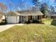 Charming single-story home with a well-manicured lawn and a one car garage at 4804 Red Coat Ct, Raleigh, NC 27616