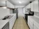 Spacious kitchen with ample white cabinets and stainless steel appliances at 4804 Red Coat Ct, Raleigh, NC 27616