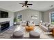 Cozy living room featuring a fireplace, vaulted ceilings, and ample natural light at 4804 Red Coat Ct, Raleigh, NC 27616