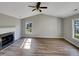 Bright living room with vaulted ceilings, laminate floors, and a cozy fireplace at 4804 Red Coat Ct, Raleigh, NC 27616