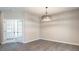 Dining room with modern chandelier and view into another room through French doors at 4879 Pioneer Dr, Sanford, NC 27330