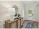 Bright entryway with wood floors, stylish console table, and decorative mirror at 4879 Pioneer Dr, Sanford, NC 27330