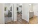 A view down a hallway of the entryway and a bedroom suite at 4879 Pioneer Dr, Sanford, NC 27330