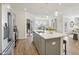 Open-concept kitchen with stainless steel appliances and ample countertop space overlooks the dining room at 4879 Pioneer Dr, Sanford, NC 27330