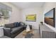 Stylish living room with a comfortable sofa, modern furniture, and window views at 4879 Pioneer Dr, Sanford, NC 27330