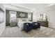 Stunning main bedroom featuring neutral tones, tray ceiling, and carpet floors at 4879 Pioneer Dr, Sanford, NC 27330