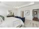 Elegant main bedroom with tray ceiling, carpet floors, and sitting area at 4879 Pioneer Dr, Sanford, NC 27330