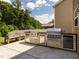 The home's backyard features a built-in outdoor kitchen and grill area for outdoor dining at 516 Spaulding St, Burlington, NC 27215