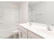 Bathroom featuring double sinks with white cabinets, toilet, shower-tub combo at 516 Spaulding St, Burlington, NC 27215