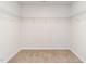 Walk-in closet with neutral carpet and white wire shelving at 516 Spaulding St, Burlington, NC 27215
