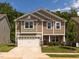 Charming two-story home with a two-car garage and manicured lawn, perfect for curb appeal at 516 Spaulding St, Burlington, NC 27215