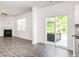 Cozy living area with fireplace, a sliding glass door to backyard, and modern gray flooring at 516 Spaulding St, Burlington, NC 27215