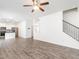 Open floor plan with kitchen, staircase, and fireplace create a welcoming and modern living space at 516 Spaulding St, Burlington, NC 27215