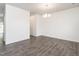 Spacious living room with modern laminate flooring and abundant natural light, ready for entertaining at 516 Spaulding St, Burlington, NC 27215