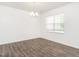 Airy living room with laminate flooring and natural light from the large window, perfect for relaxation at 516 Spaulding St, Burlington, NC 27215