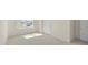Cozy bedroom with new carpet, fresh paint, and sun-drenched window overlooking the neighborhood at 519 Fife Ct, Gibsonville, NC 27249