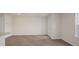 Open living space with exterior door and large window letting in plenty of natural light at 519 Fife Ct, Gibsonville, NC 27249
