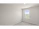Bright bedroom featuring plush carpeting and a window offering natural light at 521 Fife Ct, Gibsonville, NC 27249