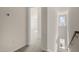 Hallway with stairway featuring natural lighting and neutral colored walls and floors at 521 Fife Ct, Gibsonville, NC 27249