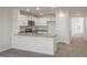 Bright kitchen with white cabinets, granite countertops, stainless steel appliances, and wood-look flooring at 521 Fife Ct, Gibsonville, NC 27249