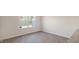 Bright room with modern flooring and a large window, offering ample natural light and a spacious feel at 521 Fife Ct, Gibsonville, NC 27249